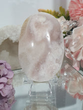 Load image into Gallery viewer, Pink Amethyst / Flower Agate Crystal Palm Stone palmstone on stand.

Inspires ENCOURAGEMENT &amp; SELF DISCOVERY

Pink Amethyst / Flower Agate Crystal Palm stone on plastic stand. So lovely.  
