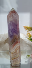 Load image into Gallery viewer, Lovely Amethyst Agate Tower. stunning tower just has a slight lean and the tip has paint or something on it. doesnt look like stone.  think it might have paint on or part of the tip protection. apart from this the colouring is gorgeous. 
