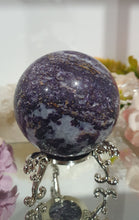 Load image into Gallery viewer, Purple Sphalerite Sphere Crystal Carving on Silver Stand.

Inspires Spirituality &amp; Strength

Stunning Purple Sphalerite Crystal Sphere on Silver Sand. This has a gorgeous quartz vein and pocket of druzy. 
