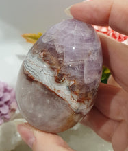 Load image into Gallery viewer, Amethyst Agate Egg Crystal Carving Stone on Stand

Inspires intuition and Emotional Well Being

Beautiful Polished Amethyst Agate Egg Crystal Carving on plastic stand. Has natural divits formations.
