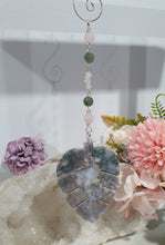 Load image into Gallery viewer, LEAF OF RENEWAL - Handcrafted Moss Agate Leaf silver Crystal Energy Enhancer© / Hanger / Ornament / Suncatcher 

SPIRITUAL GROWTH | LOVE | BALANCE

Gorgeous Moss Agate leaf crystal carving beaded with Rose Quartz &amp; Moss Agate. Wire wrapped in silver

Genuine Crystals. no plastic or glass. Ensuring energy flow throughout the enhancer. 


