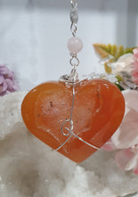 Load image into Gallery viewer, HEART OF LOVE &amp; SEDUCTION" -  - Carnelian Heart Silver Wired Stone Crystal Energy Enhancer© Hanger Suncatcher Ornament 200mm | Inspires Sensuality, Love &amp; Stability

INSPIRES SENSUALITY | LOVE | STABILITY 

Carnelian heart Crystal Energy Enhancer© / Hanger / Ornament beaded with Carnelian, Rose Quartz, Hematite, Herkimer Diamonds and quartz.  wired in silver
