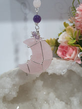 Load image into Gallery viewer, THE PINK MOON" Handcrafted Rose Quartz Moon Carving Stone Silver Crystal Energy Enhancer© Hanger Ornament Suncatcher 

INSPIRES LOVE | HARMONY | GROWTH

Beautiful Rose Quartz Moon Crystal Carving beaded with Rose Quartz and Amethyst. wired in silver
