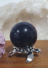 Load image into Gallery viewer, Blue Sandstone Sphere Crystal Carving on Silver Turtle Stand | Inspires Concentration and Courage

Beautiful Blue Sandstone Sphere Crystal Carving on Silver Stand in the shape of a turtle. This is so lovely and sparkly. 


