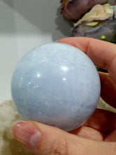 Load image into Gallery viewer, Celestite Sphere Crystal Carving on Silver Stand. Inspires Communication with the Angels
