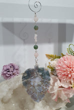 Load image into Gallery viewer, LEAF OF RENEWAL - Handcrafted Moss Agate Leaf silver Crystal Energy Enhancer© / Hanger / Ornament / Suncatcher 

SPIRITUAL GROWTH | LOVE | BALANCE

Gorgeous Moss Agate leaf crystal carving beaded with Rose Quartz &amp; Moss Agate. Wire wrapped in silver

Genuine Crystals. no plastic or glass. Ensuring energy flow throughout the enhancer. 


