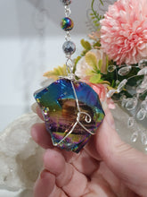 Load image into Gallery viewer, COSMIC ARMOUR - Handcrafted Rainbow Obsidian Stone Crystal Energy Enhancer© / Hanger / Ornament / Suncatcher 

INSPIRES PROTECTION AND GROUNDING

Gorgeous Rainbow Obsidian raw crystal stone beaded with Rainbow Hematite and Hematite. Wire wrapped in silver
