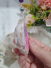 Load image into Gallery viewer, MAGICAL CRYSTAL CAVE - Handcrafted Titanium Aura Quartz Geode Crystal Energy Enhancer© / Hanger / Ornament / Suncatchers

DIVINE COMMUNICATION | HARMONY | MAGICK

Gorgeous Titanium Aura Quartz Geode crystal beaded with Rose Quartz, Amethyst and Rainbow Hematite. Wire wrapped in silver

Genuine Crystals. no plastic or glass. Ensuring energy flow throughout the enhancer.
