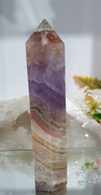 Load image into Gallery viewer, Lovely Amethyst Agate Tower. stunning tower just has a slight lean and the tip has paint or something on it. doesnt look like stone.  think it might have paint on or part of the tip protection. apart from this the colouring is gorgeous. 
