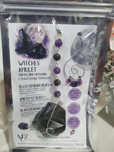 Load image into Gallery viewer, WITCHES AMULET - Handcrafted Obsidian Stone Crystal Energy Enhancer© / Hanger / Ornament / Suncatcher 

INSPIRES PROTECTION AND INTUITION

Gorgeous Obsidian raw crystal stone beaded with Black Obsidian and Amethyst. Wire wrapped in silver
