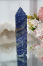 Load image into Gallery viewer, SECONDS STOCK  Sodalite Crystal Point Tower Stone

Inspires Self Esteem 

THIS POINT IS A BIT WOBBLY

Lovely Sodalite point tower.  its a tad wobbly


