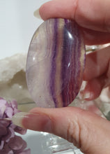 Load image into Gallery viewer, Fluorite Crystal Palm Stone palmstone on plastic stand. 

Inspires CONCENTRATION AND STABILITY

Lovely Fluorite Crystal Palm stone on plastic stand. So pretty.  
