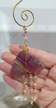 Load image into Gallery viewer, Lovely "EVERY CLOUD HAS A SILVER LINING" Fluorite Cloud gold wired Crystal Energy Enhancer© Hanger Ornament Suncatcher.

From Darkness comes Light. 

TRANSFORMATION / INTUITION / SPIRITUALITY

Beautiful Fluorite Cloud Crystal Carving beaded with Fluorite &amp; Quartz.  wired in Gold

