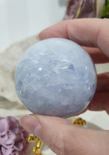 Load image into Gallery viewer, Celestite Sphere Crystal Carving on Gold Stand. Inspires Communication with the Angels
