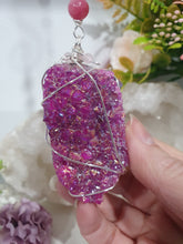 Load image into Gallery viewer, ENCHANTED AURA - Handcrafted Titanium Aura Quartz Crystal Energy Enhancer© / Hanger / Ornament / Suncatcher 

inspires EMPOWERMENT | COMPASSION | MAGICK

Gorgeous Titanium Aura Quartz crystal beaded with Rhodochrosite, Amethyst and Rose Quartz. Wire wrapped in silver

Genuine Crystals. no plastic or glass. Ensuring energy flow throughout the enhancer. Crystal Suncatchers
