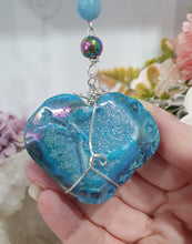 Load image into Gallery viewer, HEART OF THE OCEAN" Handcrafted Titanium Aura Sphalerite Heart Crystal Carving Silver Crystal Energy Enhancer© / Hanger / Ornament / Suncatcher

Inspires PSYCHIC FLOW | LOVE | INTUITION

Gorgeous Titanium Aura Sphalerite heart crystal carving stone beaded with Aquamarine, Rainbow Hematite &amp; Quartz.  Wire wrapped in silver
