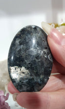 Load image into Gallery viewer, Lavakite Palm Stone Crystal Carving on Stand

Inspires Protection and Grounding

Beautiful Lavakite Palmstone palm stome Crystal Carving on stand.   So much shine on thie stone.  
