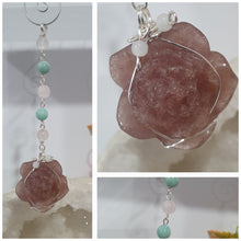 Load image into Gallery viewer, "THE BLUSHING ROSE" Strawberry Quartz Rose Carving silver Crystal Energy Enhancer© Hanger Ornament Suncatcher.

HAPPINESS / LOVE / HARMONY

"THE BLUSHING ROSE - Like the petals of a rose unfolding, The Blushing Rose encourages us to embrace self-love, joy and the beauty within."

Gorgeous Strawberry Quartz Rose Crystal Carving beaded with Ice Pink Malaysian Jade, Rose Quartz, Amazonite and Quartz. Wire wrapped in silver
