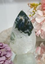 Load image into Gallery viewer, Moss Agate Flame Tower Crystal Carving Stone. Discounted because she is a tad wobbly BUT she has the most glorious Stalactite!

INSPIRES GROUNDING AND CONNECTION TO EARTH

Lovely Moss Agate Flame Crystal Carving Stone.  Wobby with a gorgeous stata

