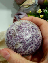 Load image into Gallery viewer, Unicorn Stone Sphere Crystal Carving on Gold Stand. Inspires Calmness, Empathy and Joy. 
Unicorn Stone consists of Pink Tourmaline, Lepidolite &amp; Smokey Quartz

