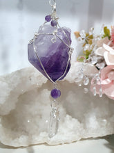 Load image into Gallery viewer, THE MYSTIC AWAKENING" Handcrafted Amethyst Raw Crystal Stone Silver Crystal Energy Enhancer© Hanger Ornament Suncatcher

INSPIRES INTUITION, WISDOM AND SPIRITUALITY

Stunning Raw Amethyst crystal stone beaded with Amethyst and Quartz. Wire wrapped in silver
