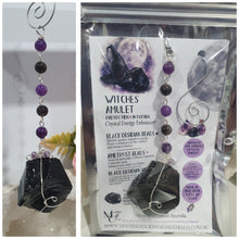 Load image into Gallery viewer, WITCHES AMULET - Handcrafted Obsidian Stone Crystal Energy Enhancer© / Hanger / Ornament / Suncatcher 

INSPIRES PROTECTION AND INTUITION

Gorgeous Obsidian raw crystal stone beaded with Black Obsidian and Amethyst. Wire wrapped in silver
