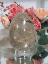 Load image into Gallery viewer, Beautiful polished Septarian Egg Crystal Carving Stone on plastic stand. A must for any crystal collector 
