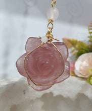 Load image into Gallery viewer, "THE BLUSHING ROSE" Strawberry Quartz Rose Carving gold Crystal Energy Enhancer© Hanger Ornament Suncatcher.

HAPPINESS / LOVE / HARMONY

"THE BLUSHING ROSE - Like the petals of a rose unfolding, The Blushing Rose encourages us to embrace self-love, joy and the beauty within."

Gorgeous Strawberry Quartz Rose Crystal Carving beaded with Ice Pink Malaysian Jade, Rose Quartz, Amazonite and Quartz. Wire wrapped in gold
