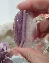 Load image into Gallery viewer, Fluorite Crystal Palm Stone palmstone on plastic stand. 

Inspires CONCENTRATION AND STABILITY

Lovely Fluorite Crystal Palm stone on plastic stand. So pretty.  
