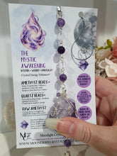 Load image into Gallery viewer, THE MYSTIC AWAKENING" Handcrafted Amethyst Raw Crystal Stone Silver Crystal Energy Enhancer© Hanger Ornament Suncatcher

INSPIRES INTUITION, WISDOM AND SPIRITUALITY

Stunning Raw Amethyst crystal stone beaded with Amethyst and Quartz. Wire wrapped in silver
