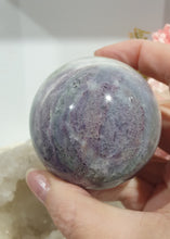 Load image into Gallery viewer, Beautiful Fluorite Sphere Crystal Carving on Silver Stand. Inspires Stability, Grounding and Concentration. Lovely patterns and colouring with inclusions. 

