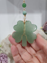 Load image into Gallery viewer, "FOUR-LEAF CLOVER BLESSINGS" Aventurine Crystal Carving Gold Stone Crystal Energy Enhancer© / Hanger / Ornament / Suncatcher

GOOD FORTUNE | HOPE | MAGIC | PROTECTION

A four-leaf clover Symbolises good luck and abundance. It is believed if you hold a four-leaf clover you will gain the ability to see fairies and leprechauns and find their treasures.&nbsp;

Beautiful Aventurine four-leaf clover crystal carving beaded with Amazonite, Aventurine and Quartz. Wire wrapped in Gold
