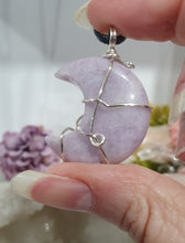 Load image into Gallery viewer, Lepidolite Moon Crystal Pendant Wire Wrapped Silver Stone with black cord chain

STONE OF TRANSITION

Beautiful Lepidolite Moon Crystal Carving Wire Wrapper in Silver non tarnish wire. Accompanied by a black cord necklace
