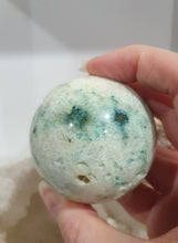 Load image into Gallery viewer, Phoenix Stone Sphere Crystal Carving Stone on Silver Stand

Inspires Compassion

Lovely Phoenix Stone Crystal Sphere Carving Stone on silver stand.  
