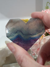 Load image into Gallery viewer, Heart Fluorite Crystal Carving Stone on plastic Stand

Inspires CONCENTRATION AND STABILITY

Lovely Fluorite Heart crystal carving on plastic stand.  super pretty.   

