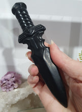 Load image into Gallery viewer, Beautiful polished Black Obsidian Athame (Dagger) Crystal Carving Stone.  

INSPIRES PROTECTION AND BALANCE

An Athame is a ceremonial knife used in spiritual rituals to direct energy, cast circles, and represent the element of fire or air, but it is typically not used for physical cutting.

Stunning polished Black Obsidain Athame Dagger Crystal Carving.


