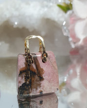 Load image into Gallery viewer, Hand Bag Rhodonite Crystal Carving Stone

Inspires Compassion 

Cute Rhodonite Handbag Crystal Carving Stone. 
