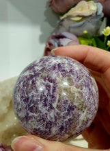 Load image into Gallery viewer, Unicorn Stone Sphere Crystal Carving on Gold Stand. Inspires Calmness, Empathy and Joy. 
Unicorn Stone consists of Pink Tourmaline, Lepidolite &amp; Smokey Quartz
