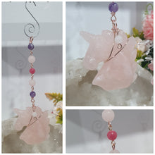 Load image into Gallery viewer, HEART OF A UNICORN" Aura Howlite Heart Stone Rose Gold Crystal Energy Enhancer© Hanger Ornament Suncatcher

Gorgeous Rose Quartz Unicorn Crystal Carving beaded with Amethyst, Rose Quartz, Rhodochrosite and Quartz. Wire wrapped in Rose Gold

