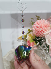 Load image into Gallery viewer, COSMIC ARMOUR - Handcrafted Rainbow Obsidian Stone Crystal Energy Enhancer© / Hanger / Ornament / Suncatcher 

INSPIRES PROTECTION AND GROUNDING

Gorgeous Rainbow Obsidian raw crystal stone beaded with Rainbow Hematite and Hematite. Wire wrapped in silver
