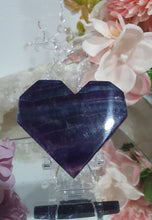 Load image into Gallery viewer, Heart Fluorite Crystal Carving Stone on plastic Stand

Inspires CONCENTRATION AND STABILITY

Lovely Fluorite Heart with blue colouring on plastic stand.  super pretty.   
