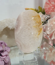 Load image into Gallery viewer, Pink Amethyst / Flower Agate Crystal Palm Stone palmstone on stand.

Inspires ENCOURAGEMENT &amp; SELF DISCOVERY

Pink Amethyst / Flower Agate Crystal Palm stone on plastic stand. So lovely.  
