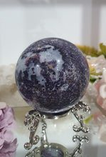 Load image into Gallery viewer, Purple Sphalerite Sphere Crystal Carving on Silver Stand.

Inspires Spirituality &amp; Strength

Stunning Purple Sphalerite Crystal Sphere on Silver Sand. This has a gorgeous quartz vein and pocket of druzy. 
