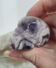 Load image into Gallery viewer, Skull Amethyst Chevron Crystal Carving Stone.

INSPIRES INTUITION &amp; SPIRITUALITY

Beautiful polished Amethyst Chevron Skull Crystal Carving Stone. 


