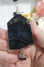 Load image into Gallery viewer, LIGHT THROUGH DARKNESS" Handcrafted Black Agate Tower Crystal Carving Silver Crystal Energy Enhancer© Gemstone / Hanger / Suncatcher / Ornament 

STRENGTH | COURAGE | CLARITY

Beautiful Black Agate Tower Carving Crystal Energy Enhancer© / Sun Catcher / Ornament / Hanger beaded with Black Agate, Quartz and Herkimer Diamonds.  wired in Silver


