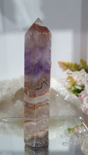 Load image into Gallery viewer, Lovely Amethyst Agate Tower. stunning tower just has a slight lean and the tip has paint or something on it. doesnt look like stone.  think it might have paint on or part of the tip protection. apart from this the colouring is gorgeous. 
