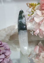 Load image into Gallery viewer, Moss Agate Flame Tower Crystal Carving Stone. Discounted because she is a tad wobbly BUT she has the most glorious Stalactite!

INSPIRES GROUNDING AND CONNECTION TO EARTH

Lovely Moss Agate Flame Crystal Carving Stone.  Wobby with a gorgeous stata
