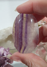 Load image into Gallery viewer, Fluorite Crystal Palm Stone palmstone on plastic stand. 

Inspires CONCENTRATION AND STABILITY

Lovely Fluorite Crystal Palm stone on plastic stand. So pretty.  
