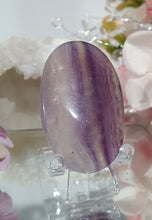 Load image into Gallery viewer, Fluorite Crystal Palm Stone palmstone on plastic stand. 

Inspires CONCENTRATION AND STABILITY

Lovely Fluorite Crystal Palm stone on plastic stand. So pretty.  
