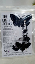 Load image into Gallery viewer, "THE LIGHTSEEKER" Metal Moth Keyring Key chain with Quartz Beads Stone Crystal Key Ring 

INSPIRES GUIDANCE AND TRANSFORMATION

Carry a little Light wherever life takes you!

Gorgeous black coloured metal Moth Keyring Key ring with rose charm, beaded with Quartz.


